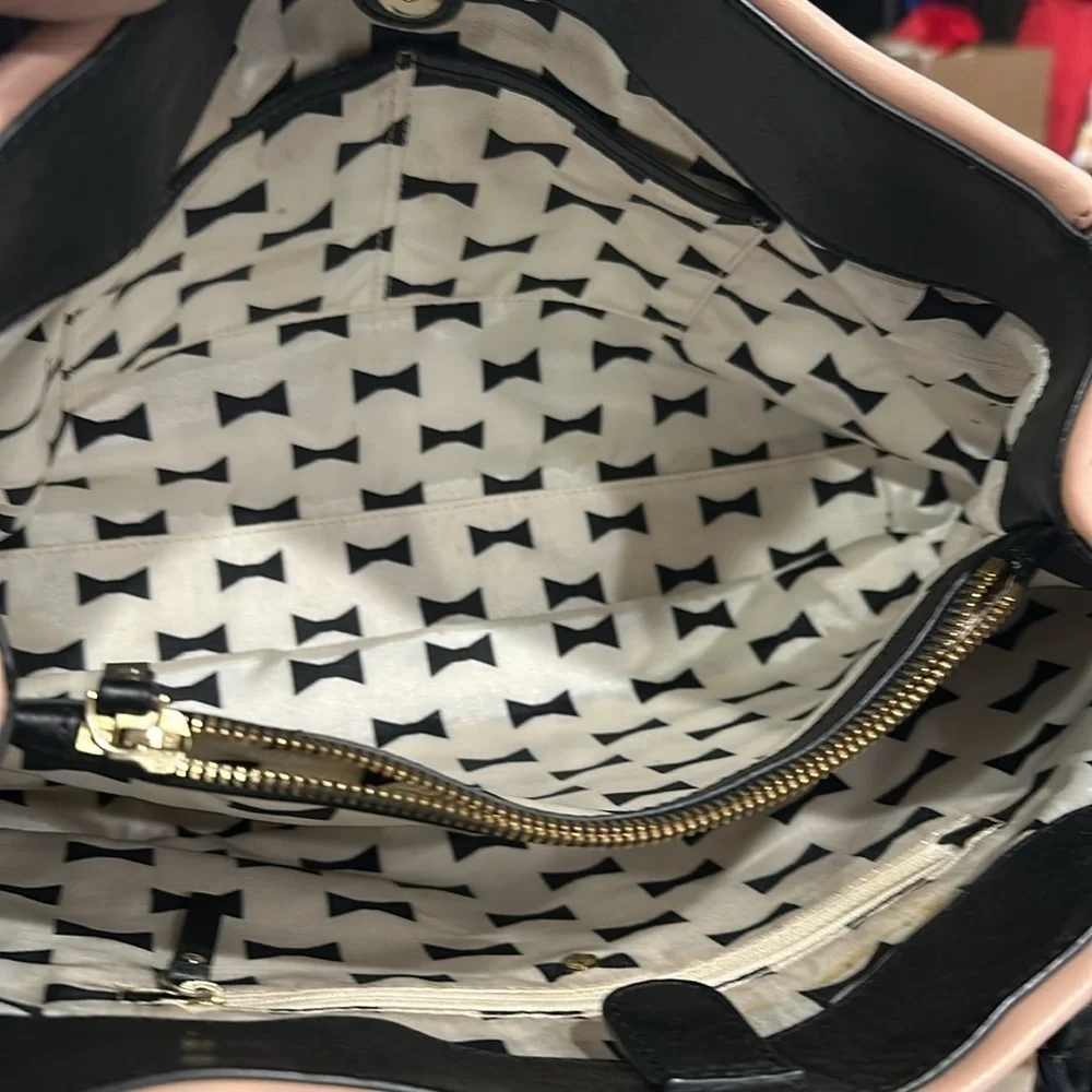 Kate Spade pink soft hobo bag, inside off-white and black bowties good used con.